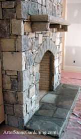 Masonry fireplace with arched opening